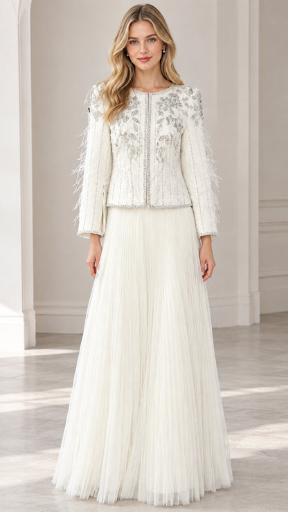 Front full view of woman wearing ivory beaded jacket and pleated maxi skirt two-piece formal set