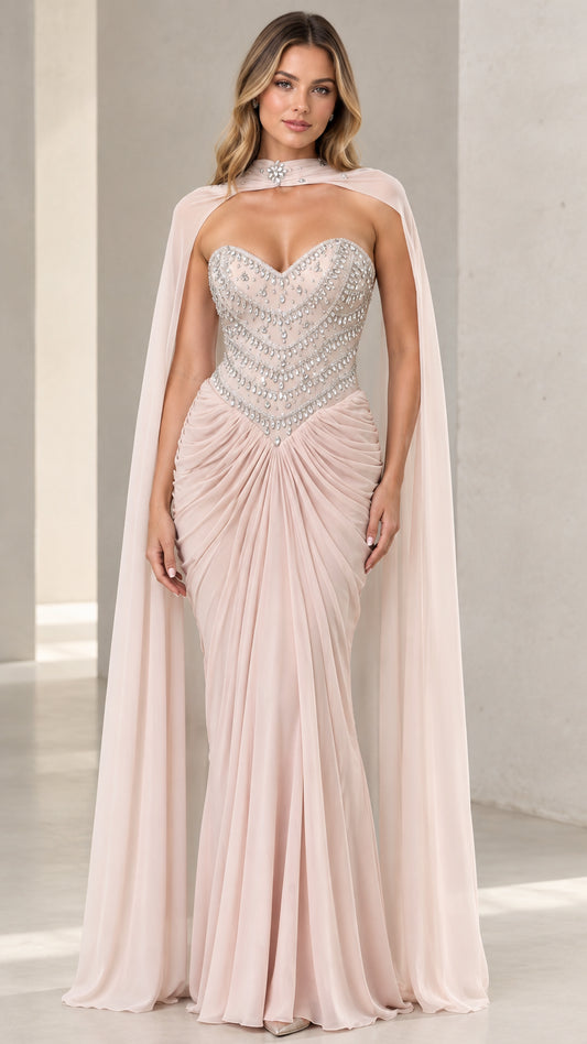 Front view of Blush Pink embellished sweetheart evening gown with sheer cape