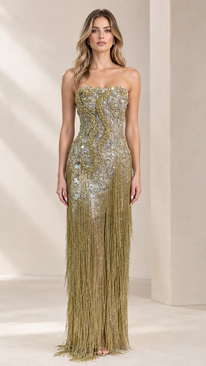Front view of model wearing strapless antique gold beaded fringe evening gown